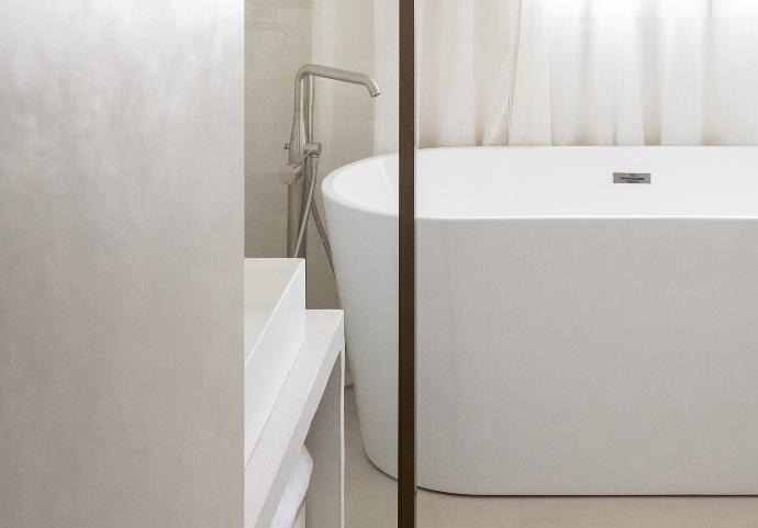 Closeup of a Bruges freestanding bathtub by Riluxa in a project designed by Alak Studio