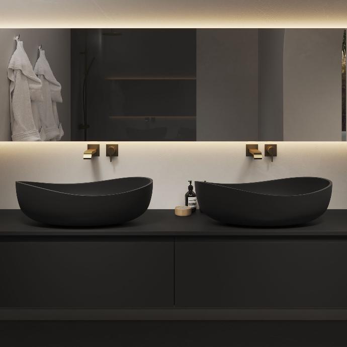 Two black Genova countertop basins on a black bathroom cabinet by Riluxa